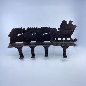 vintage sheet metal santa sleigh and 3 reindeer stocking holder set of 4